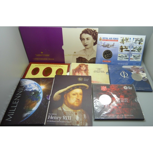 885 - Eight commemorative £5 coin packs, including RAF, Henry VIII and Millennium