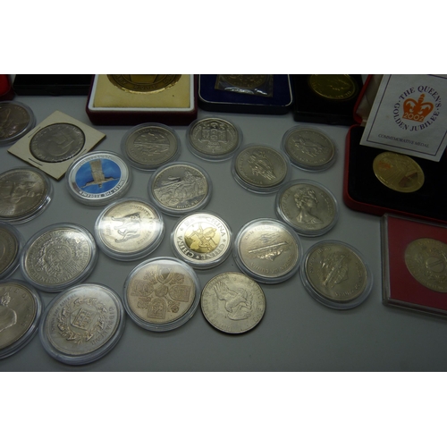 887 - A collection of commemorative coins and medals, lucky Irish penny, Isle of Man, Libera coins, etc.