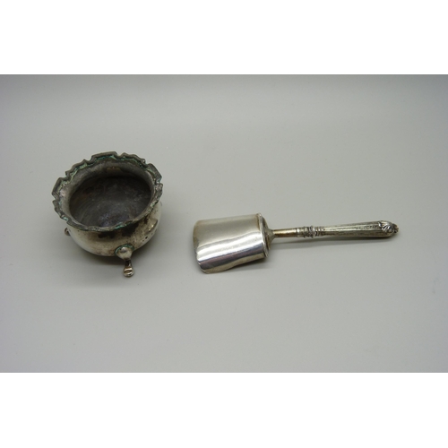 897 - A William IV silver caddy spoon, Birmingham 1834, a/f, and a silver salt, salt 25g