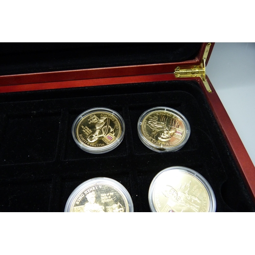 900 - A box of Westminster vintage motor vehicle coins, (18), and a box of one crown coins celebrating dif... 