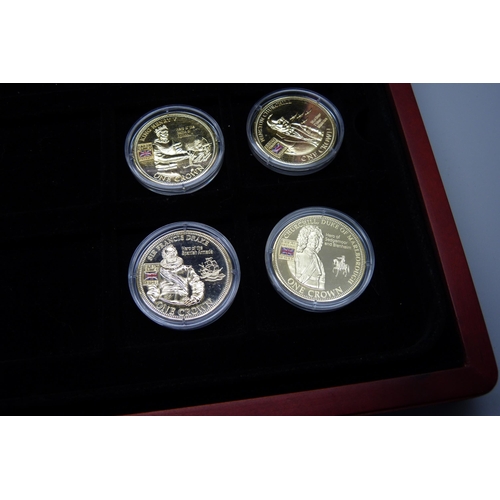 900 - A box of Westminster vintage motor vehicle coins, (18), and a box of one crown coins celebrating dif... 