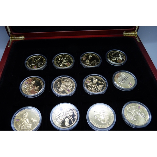 900 - A box of Westminster vintage motor vehicle coins, (18), and a box of one crown coins celebrating dif... 