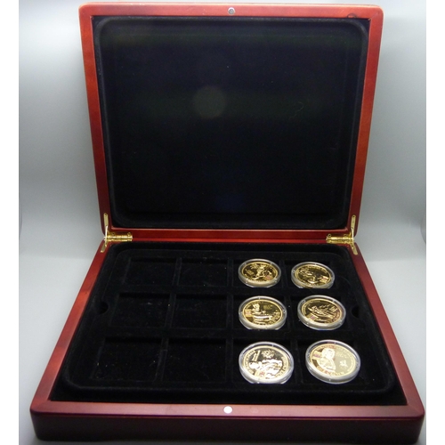 900 - A box of Westminster vintage motor vehicle coins, (18), and a box of one crown coins celebrating dif... 