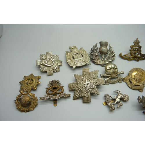 906 - Fifteen assorted cap badges