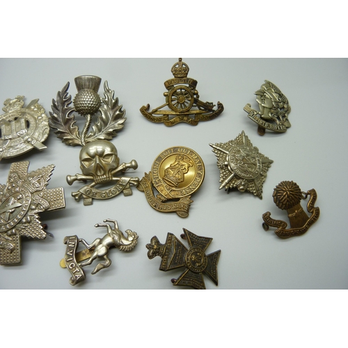 906 - Fifteen assorted cap badges