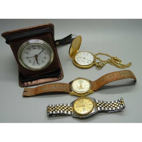 913 - A Seiko 5 automatic wristwatch, a Sekonda wristwatch, a pocket watch and a travel clock