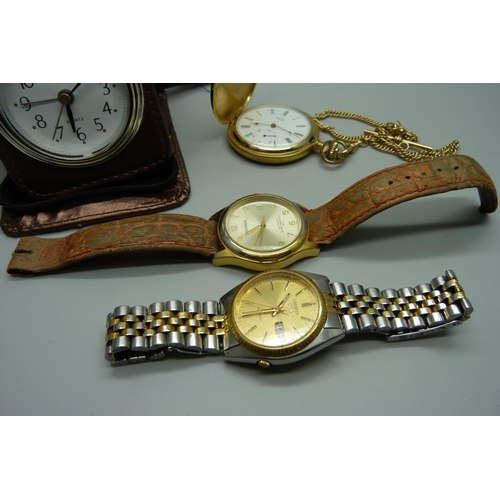 913 - A Seiko 5 automatic wristwatch, a Sekonda wristwatch, a pocket watch and a travel clock