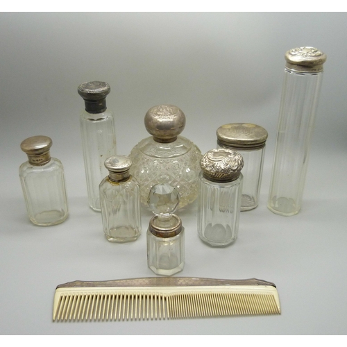 918 - A collection of silver topped bottles and jars and a silver mounted comb, some a/f