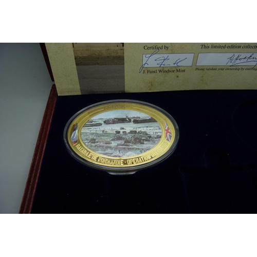 922 - Seven Windsor Mint D-Day commemorative medallions, in two cases