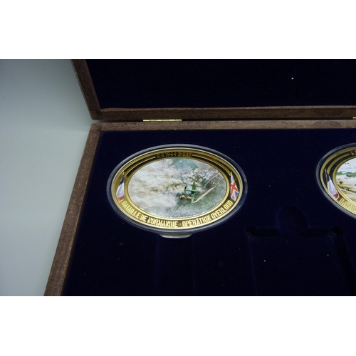 922 - Seven Windsor Mint D-Day commemorative medallions, in two cases