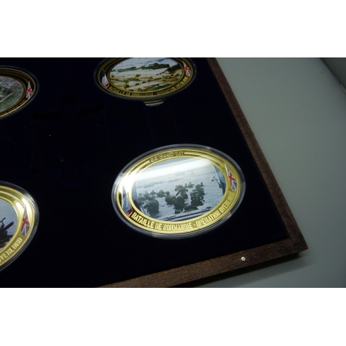 922 - Seven Windsor Mint D-Day commemorative medallions, in two cases