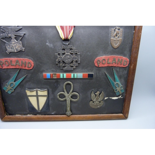 928 - A framed selection of Polish WW2 badges, medal and insignia relating to the 2nd Polish Corps includi... 