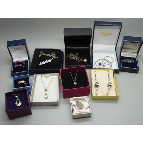 936 - A collection of silver jewellery, pendants, earrings and a ring