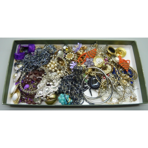 945 - A collection of costume earrings, etc.