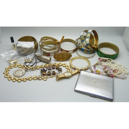 952 - A collection of costume jewellery including bangles, a Montine wristwatch, earrings, case, etc.