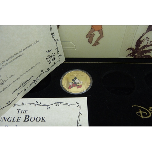 953 - A Disney Jungle Book 50p colour collection (6 coins) in packaging, and two Mickey Mouse proof coins ... 