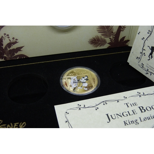 953 - A Disney Jungle Book 50p colour collection (6 coins) in packaging, and two Mickey Mouse proof coins ... 