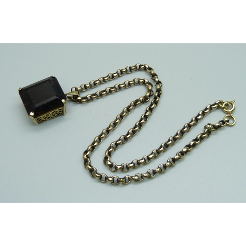 967 - A smoky quartz pendant on a vintage plated chain, chain 39cm