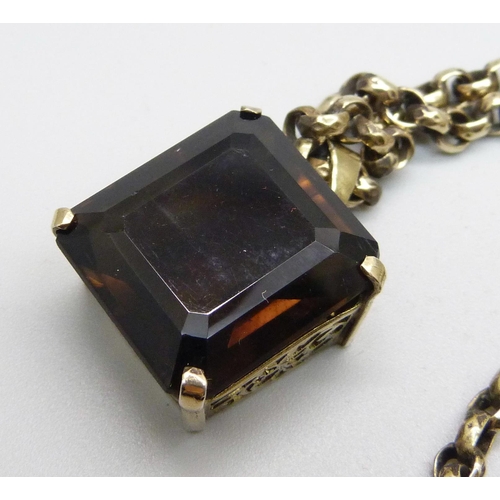 967 - A smoky quartz pendant on a vintage plated chain, chain 39cm