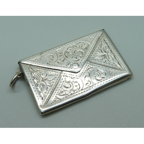 973 - An engraved silver stamp case, Birmingham 1909, 41mm wide