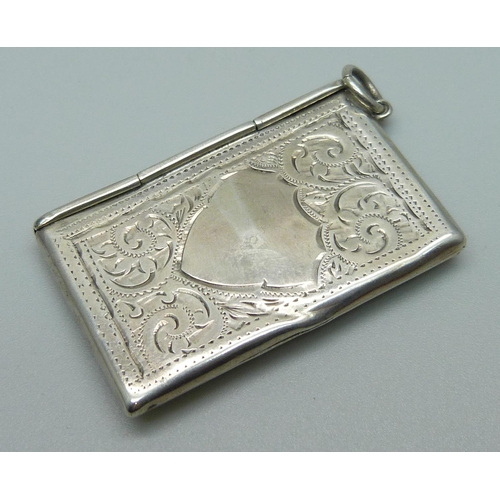 973 - An engraved silver stamp case, Birmingham 1909, 41mm wide