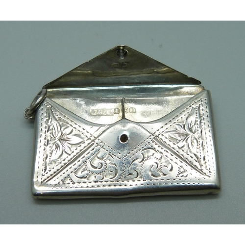 973 - An engraved silver stamp case, Birmingham 1909, 41mm wide