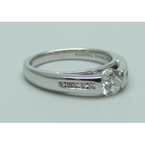 984 - An 18ct white gold set 'Kissing Diamonds' ring, 0.59ct weight, Clarity SI1, Colour G, brilliant cut ... 