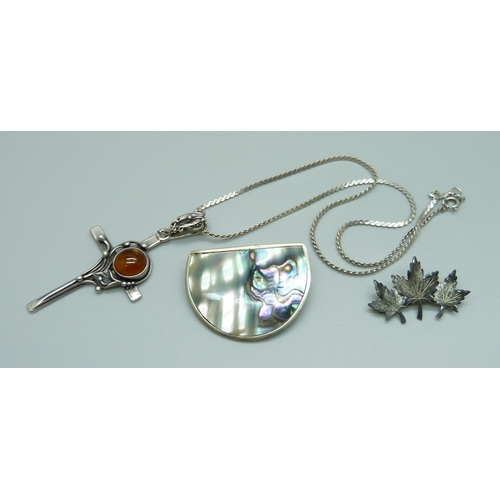 986 - A silver and amber cross pendant, a sterling brooch and an Alpaca Mexico brooch