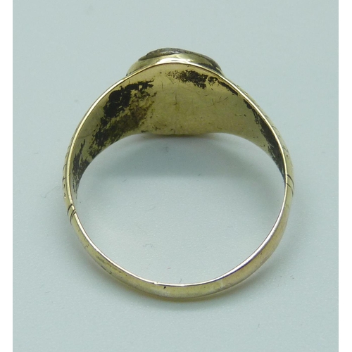 995 - A yellow metal intaglio ring, marked 18ct, 6g, U