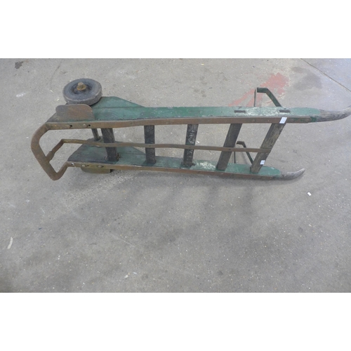 2245 - An antique oak and steel heavy duty station trolley