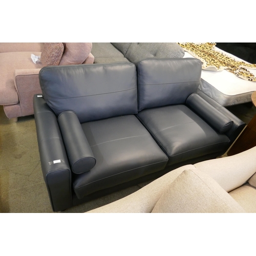 1552 - A Leo Dakota navy leather three seater sofa