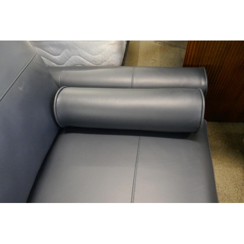 1552 - A Leo Dakota navy leather three seater sofa