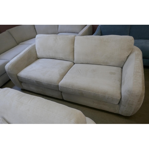 1561 - An Aspen Cecconi ivory four seater split sofa