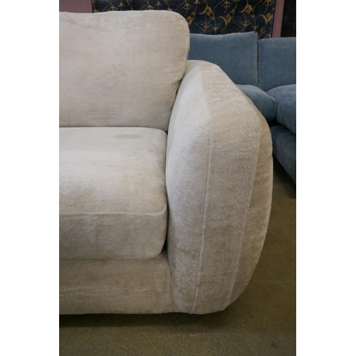 1561 - An Aspen Cecconi ivory four seater split sofa