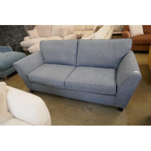 1564 - A Mina blue three seater sofa