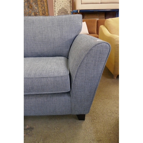 1564 - A Mina blue three seater sofa