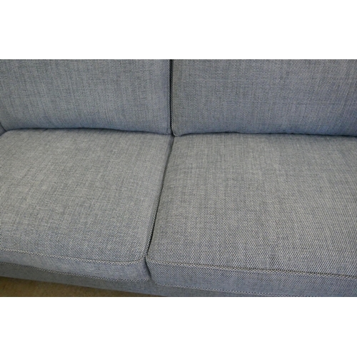 1564 - A Mina blue three seater sofa