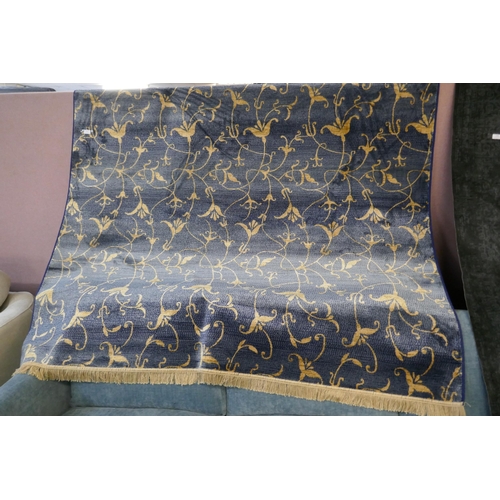 1567 - A rich blue ground Cashmere with all over gold floral pattern, 300 x 200cm