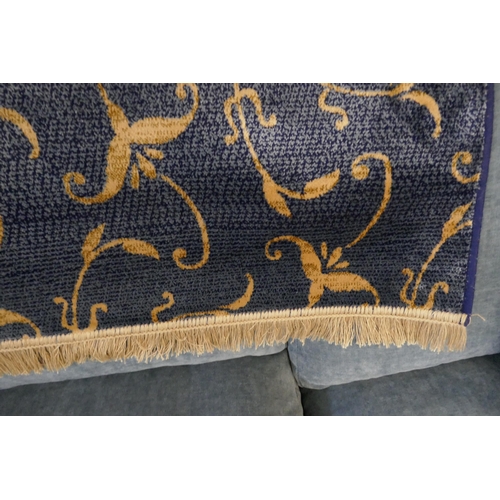 1567 - A rich blue ground Cashmere with all over gold floral pattern, 300 x 200cm