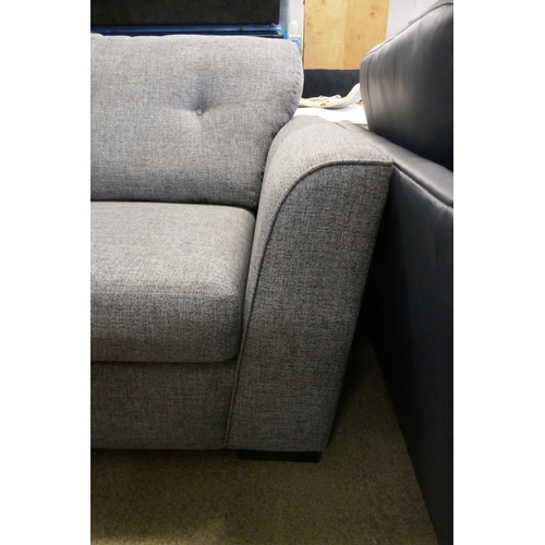 1582 - A Briggs Sparr grey three seater sofa