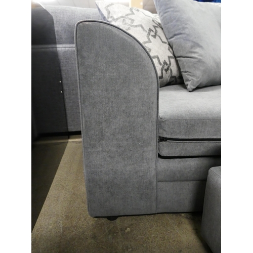 1586 - A grey upholstered corner sofa and footstool