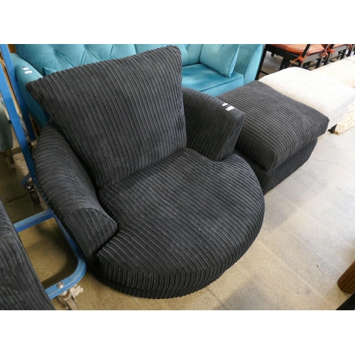 1600 - A black jumbo cord swivel armchair and footstool