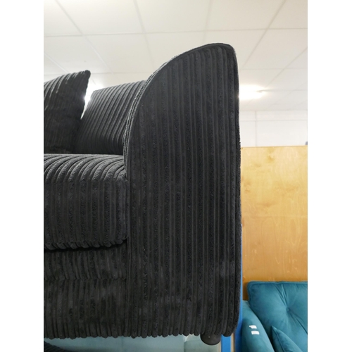 1601 - A black jumbo cord three seater and two seater sofa