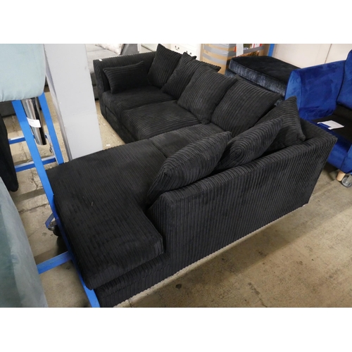 1602 - A black jumbo cord corner sofa