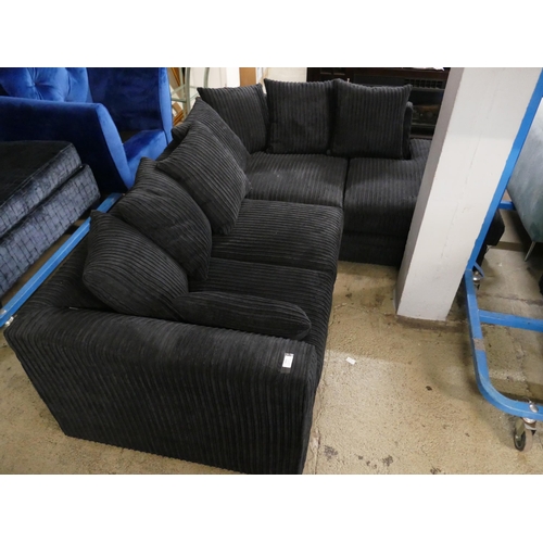 1602 - A black jumbo cord corner sofa