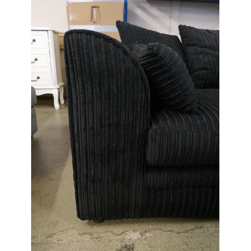 1602 - A black jumbo cord corner sofa