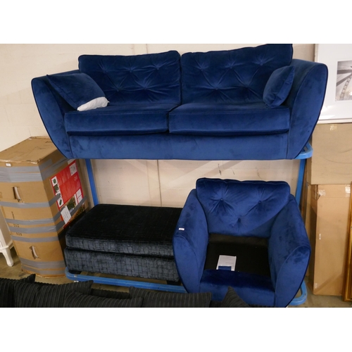 1607 - A blue velvet three seater sofa, armchair and footstool - damaged