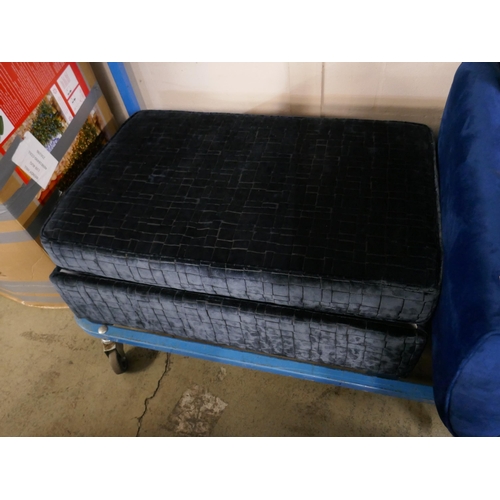 1607 - A blue velvet three seater sofa, armchair and footstool - damaged