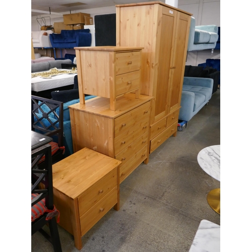 1609 - Pine bedroom suite comprising of two bedside chests a double wardrobe and a four drawer chest - boxe... 