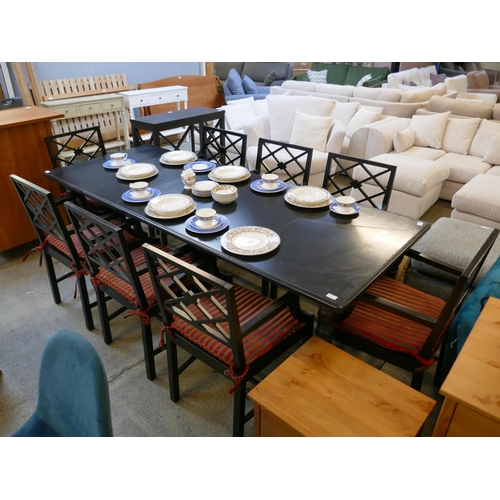 1611 - An ebonised extending dining table and eight chairs